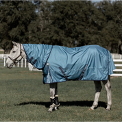 Side view of a gray horse standing in a pasture wearing the Equinavia Thunder 360 0g Detachable Neck Turnout Sheet in blue