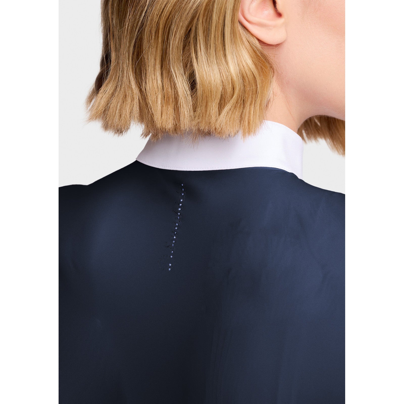 Close-up back view of a female model wearing the Navy Samshield Gretta Short Sleeve Show Shirt on a plain background