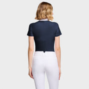 Back view of a female model wearing the Navy Samshield Gretta Short Sleeve Show Shirt on a plain background