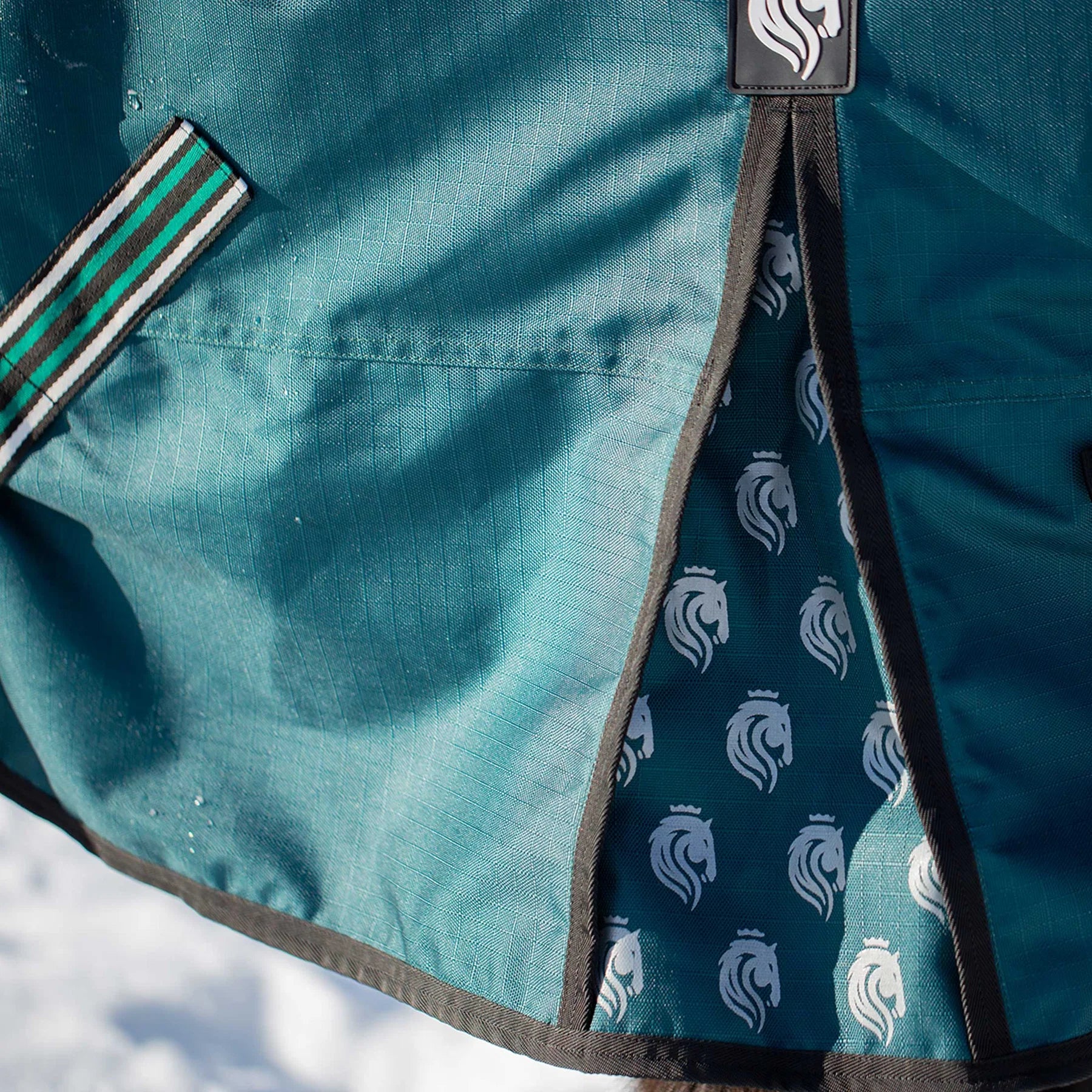 Side closeup view of a horse wearing Deep Green Equinavia Arktis Extended Neck 0g Turnout