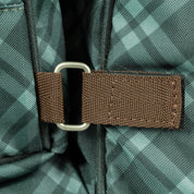 Close-up detail view of the Thyme/Lily Pad Equinavia Boot and Detachable Helmet Bag on a plain background showing the velcro connector that lets you attach or detach the helmet bag