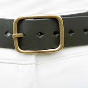 Front closeup view of a model wearing the the Equinavia Milli Diamonds Leather Belt showing the buckle