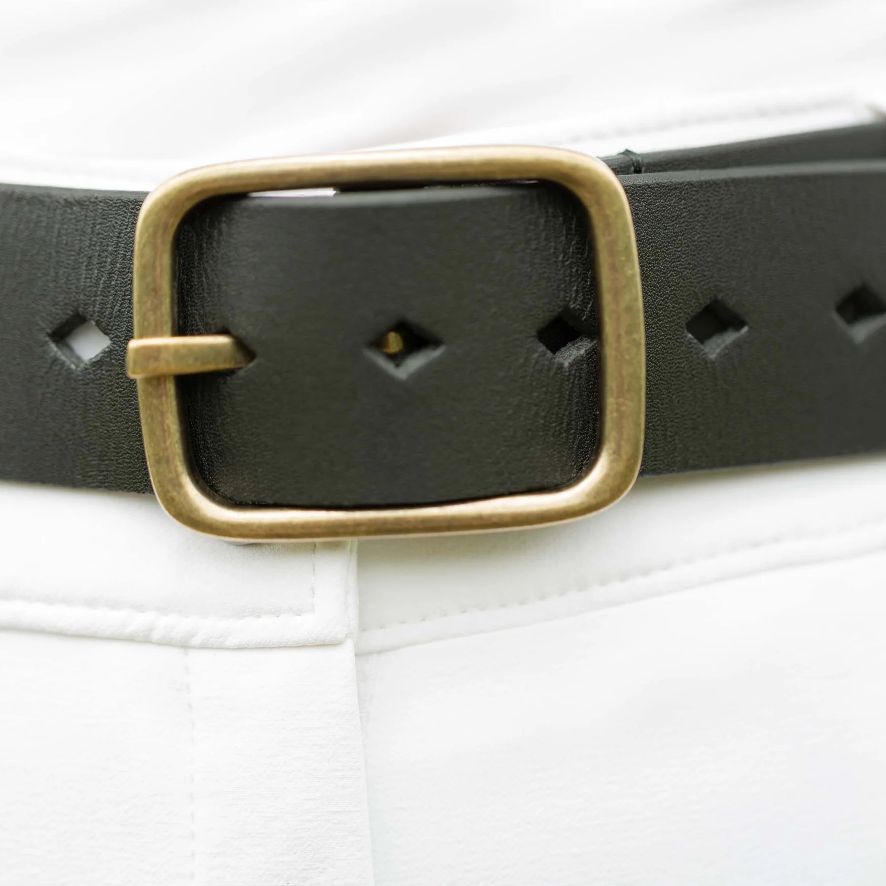 Front closeup view of a model wearing the the Equinavia Milli Diamonds Leather Belt showing the buckle