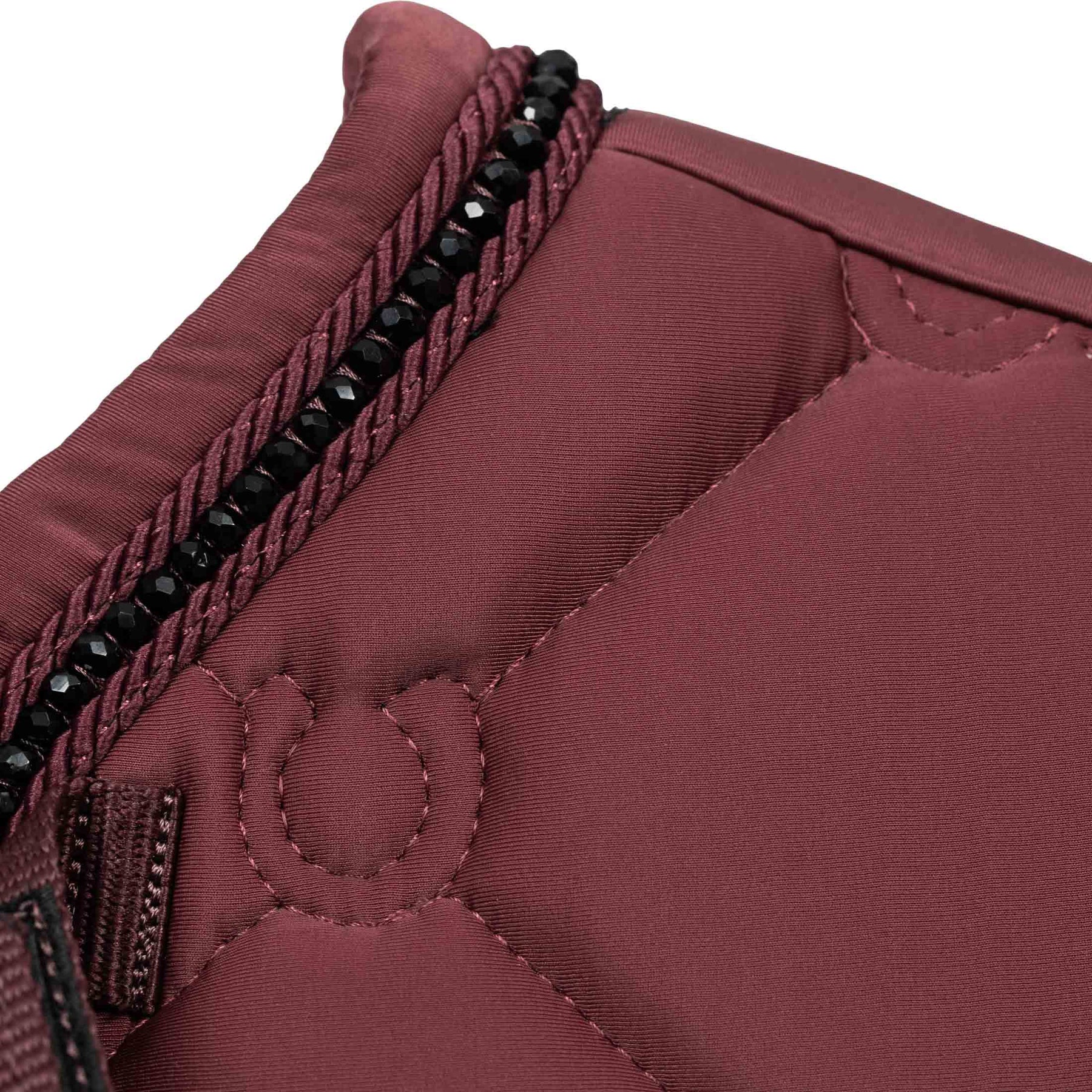 Close-up view of the withers on the Burgundy Equinavia Bergen Crystal Dressage Saddle Pad