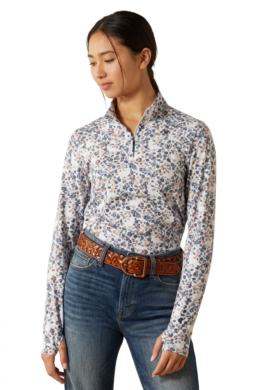 Young long sleeve quarter zip baselayer with horse and floral print shown on model on plain white background