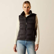 Black puffer vest with stitching shown on model