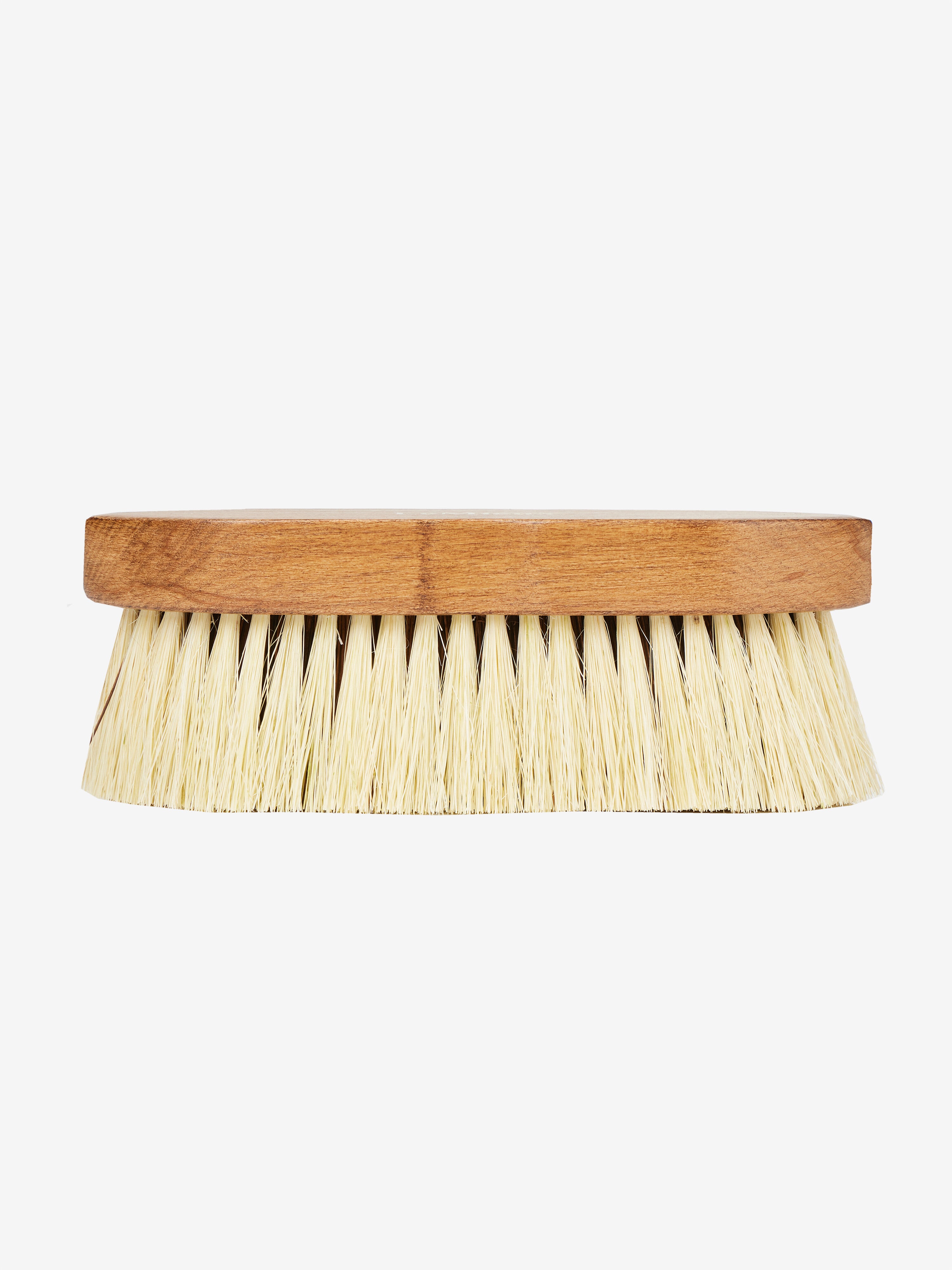 Side view of the LeMieux Artisan Deep Clean Dandy Brush on a plain background