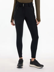 Front view of a model wearing the black DryTex Waterproof Full Seat Breeches on a white background