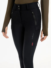 Close-up front view of a model wearing the black DryTex Waterproof Full Seat Breeches on a white background