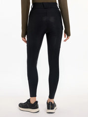 Back view of a model wearing the black DryTex Waterproof Full Seat Breeches on a white background