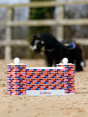 View of the LeMieux Toy Pony Puissance Wall in an arena with a toy pony in the background