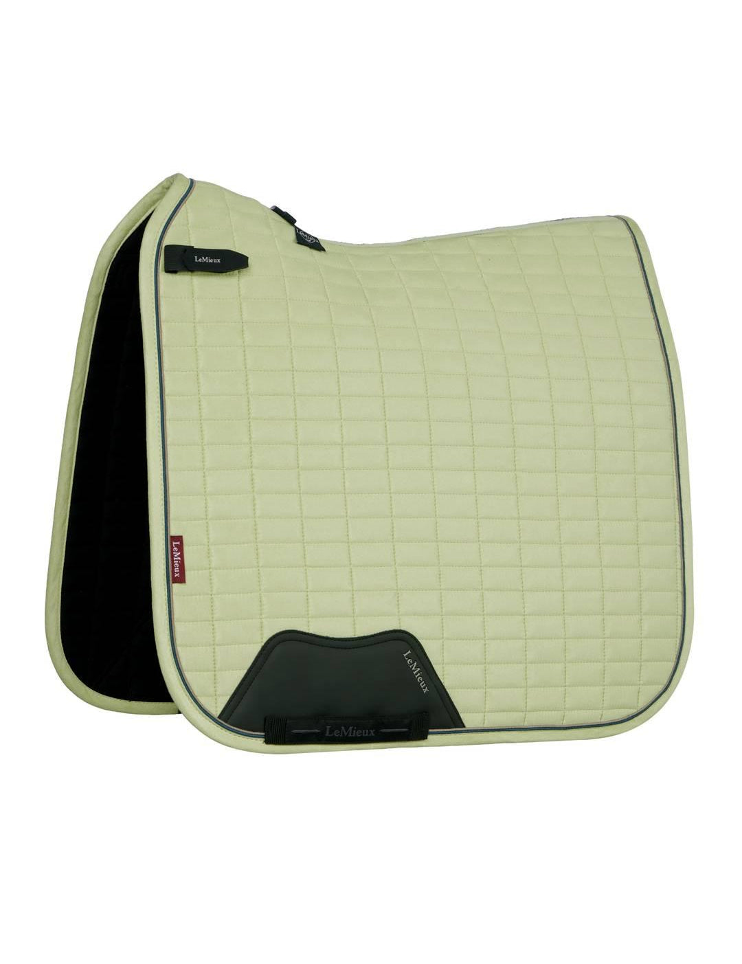 Side view of the macaron LeMieux Suede Dressage Square Pad on a white background