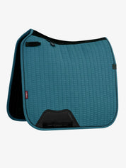 Side view of the LeMieux Essence Dressage Square in Jungle on a white background
