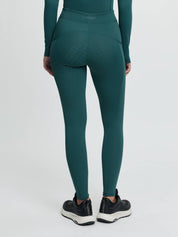 Back view of a model wearing the jungle Lemieux Young Rider Orla Pull On Tight on a plain background