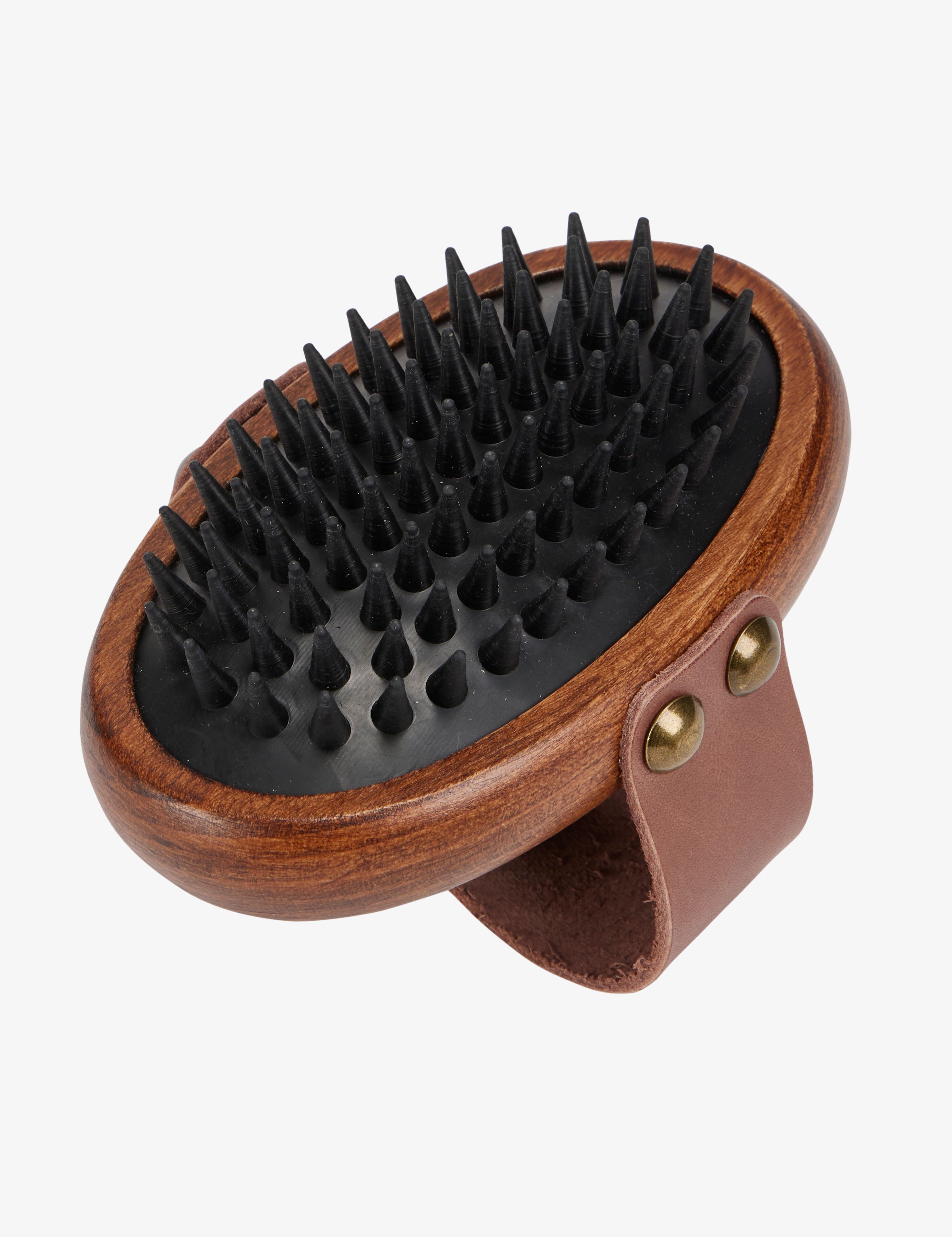 Bottom view of the Lemieux Artisan Massage Brush on a plain background