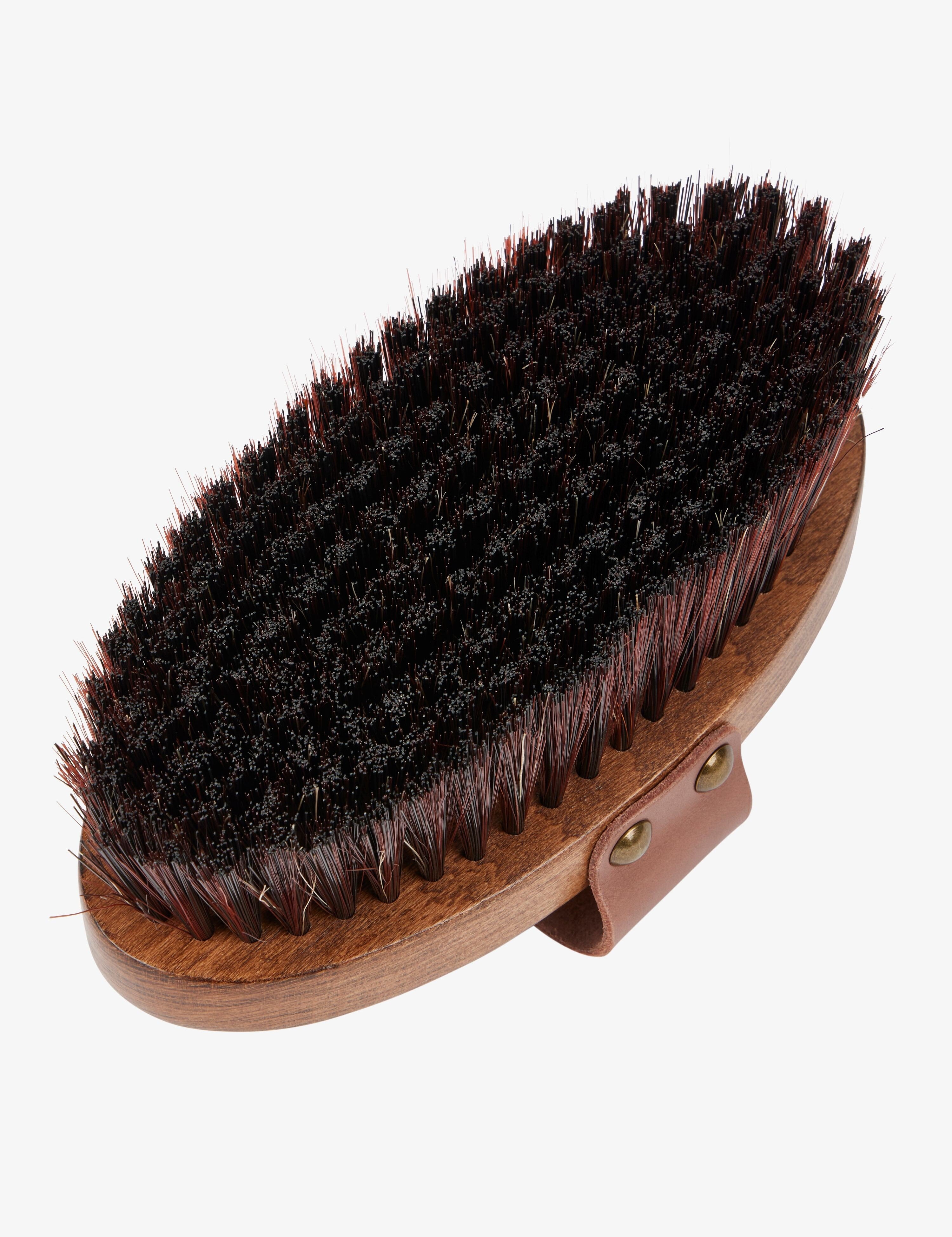 Bottom bristle view of the Lemieux Artisan Body Brush on a plain background