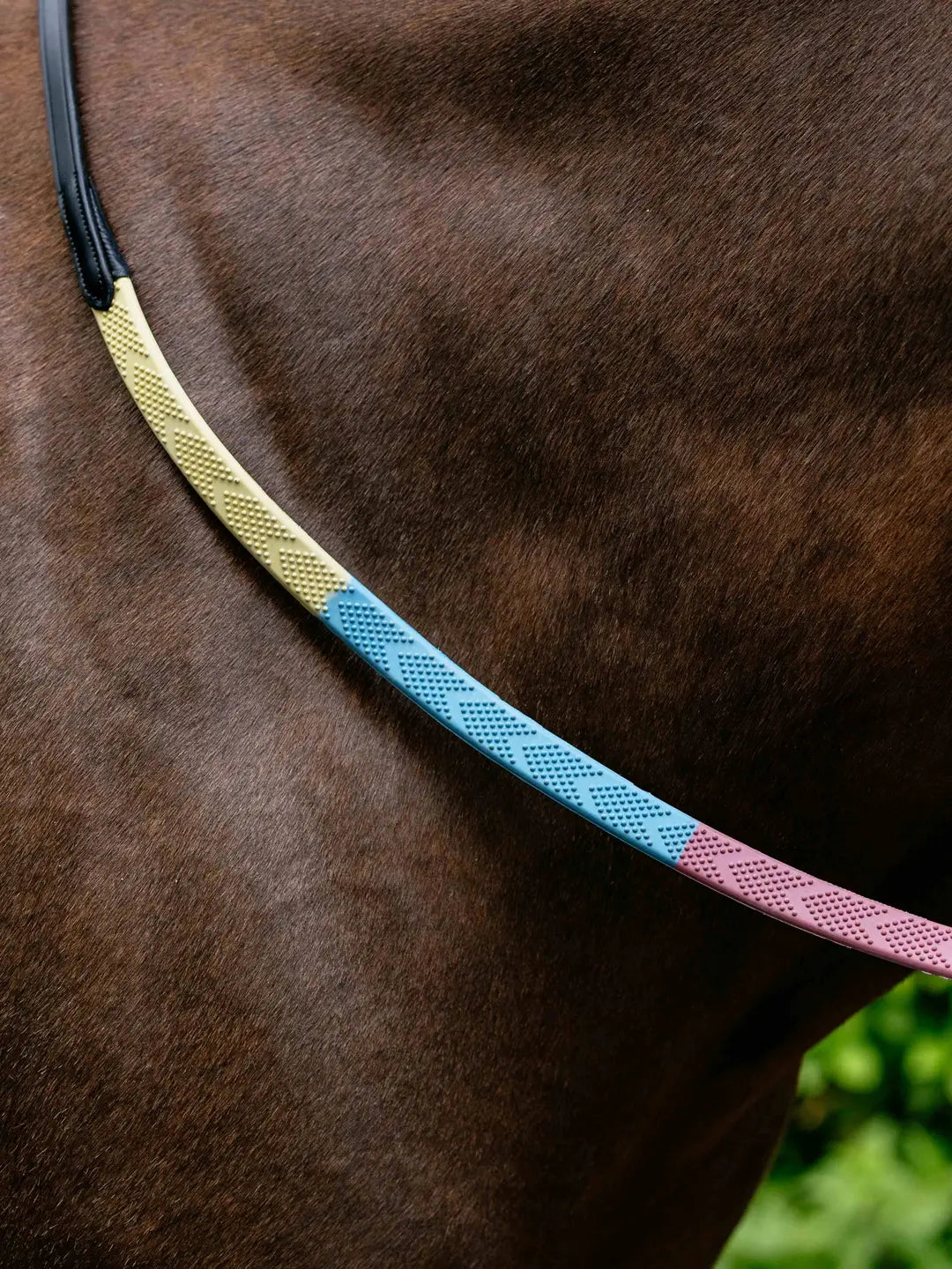 View of the Pastel LeMieux Versa Grip Reins against a dark colored horse's neck