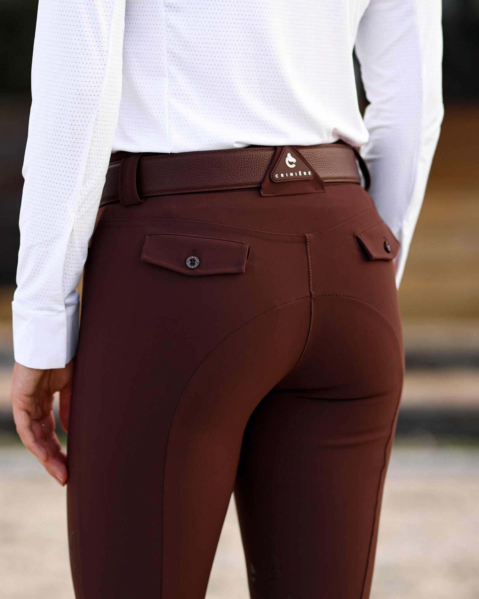 Close-up back view of a female model wearing the Mocha Criniere Juliette High Compression Half Seat Breeches