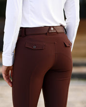 Close-up back view of a female model wearing the Mocha Criniere Juliette High Compression Half Seat Breeches