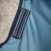 Close-up view of the Equinavia Thunder 360 0g Detachable Neck Turnout Sheet in blue