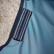 Closeup view of a horse wearing the Equinavia Thunder 360 200g Detachable Neck Turnout Blanket