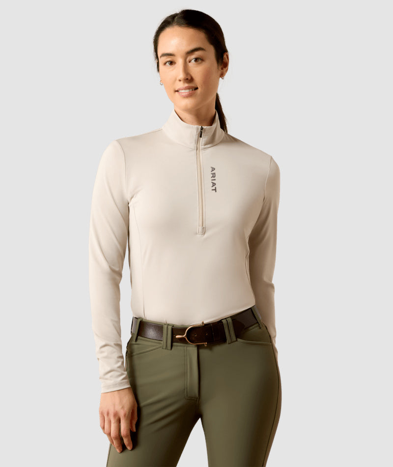 Front view of a female model wearing the Chateau Gray Ariat Lunaveil 1/2 Zip Baselayer on a plain background