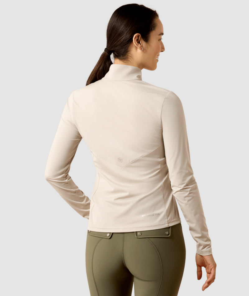 Back view of a female model wearing the Chateau Gray Ariat Lunaveil 1/2 Zip Baselayer on a plain background