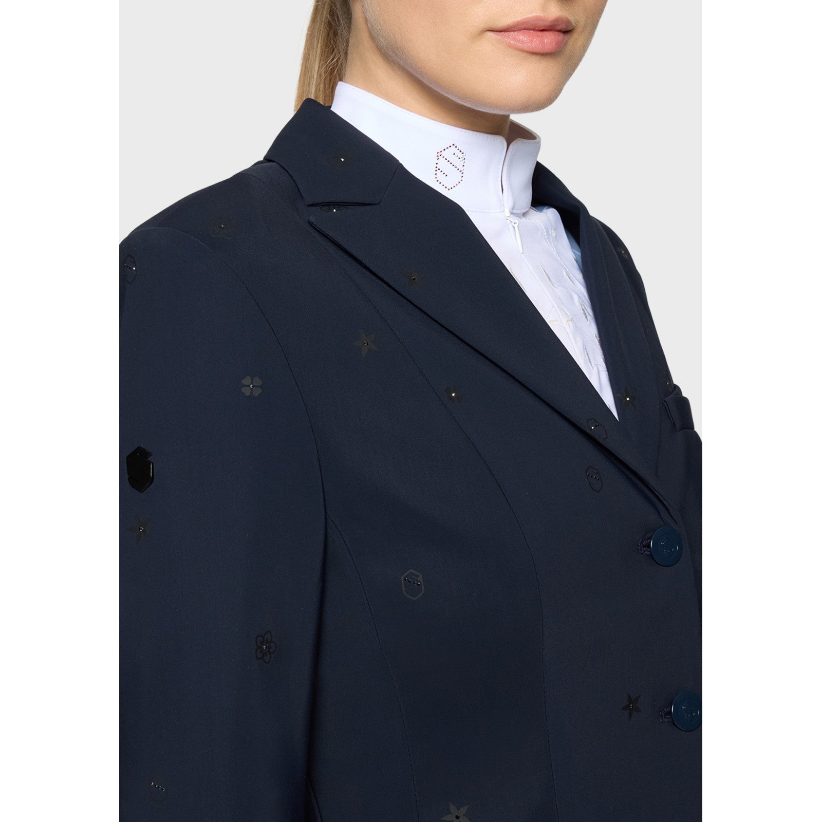 Close-up angled front view of a female model wearing the Navy Samshield Lauren Show Coat on a plain background