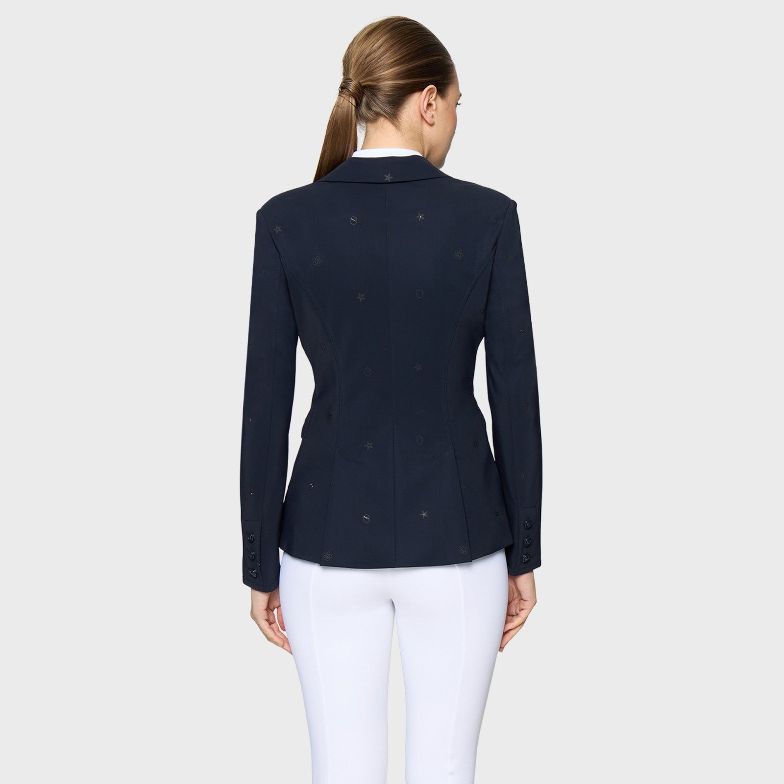 Back view of a female model wearing the Navy Samshield Lauren Show Coat on a plain background