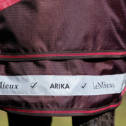 Close-up view of the reflective tape on the front of the Cranberry LeMieux Arika Ripstop 200G Turnout Blanket