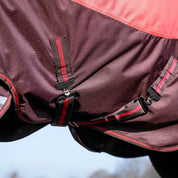 Close-up view of the belly straps on the Cranberry LeMieux Arika Ripstop 200G Turnout Blanket