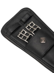Close-up view of the buckles on the Black LeMieux Gel-Tek Anatomic Dressage Girth on a plain background