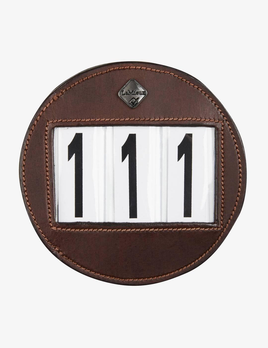 Front view of the brown LeMieux Bridle Number Holder showing 111 on a white background
