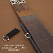 Close-up view of the Brown Total Saddle Fit StretchTec Shoulder Relief Girth – Jump on a brown background