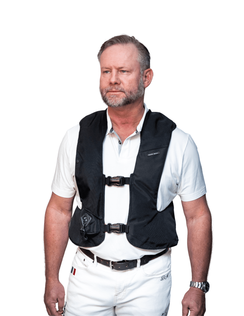 Front view of a male model wearing the Black Hit Air SV3 Airbag Vest on a white background