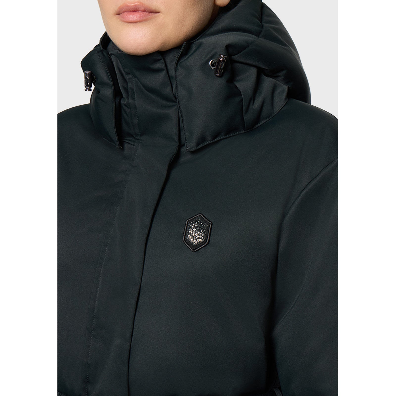 Close-up front view of a female model wearing the Moonless Night Samshield Melyne Puffer Jacket on a plain background