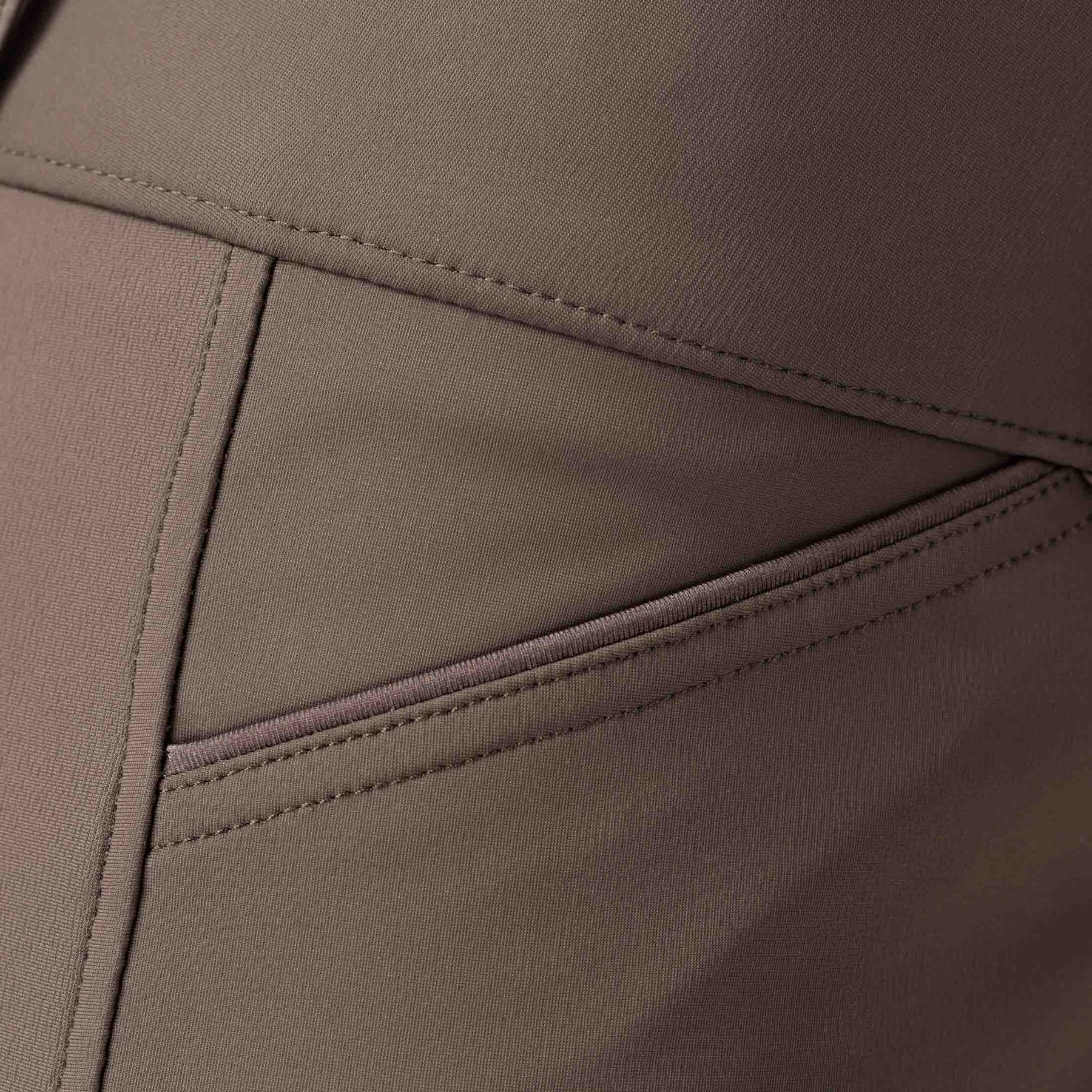 Closeup view of the Dark Brown Equinavia Maud Tech Knee Patch Breeches showing the pocket area