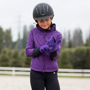Front view of a young female model wearing the Violet Horze Kids Fleece Gloves and coordinating jacket