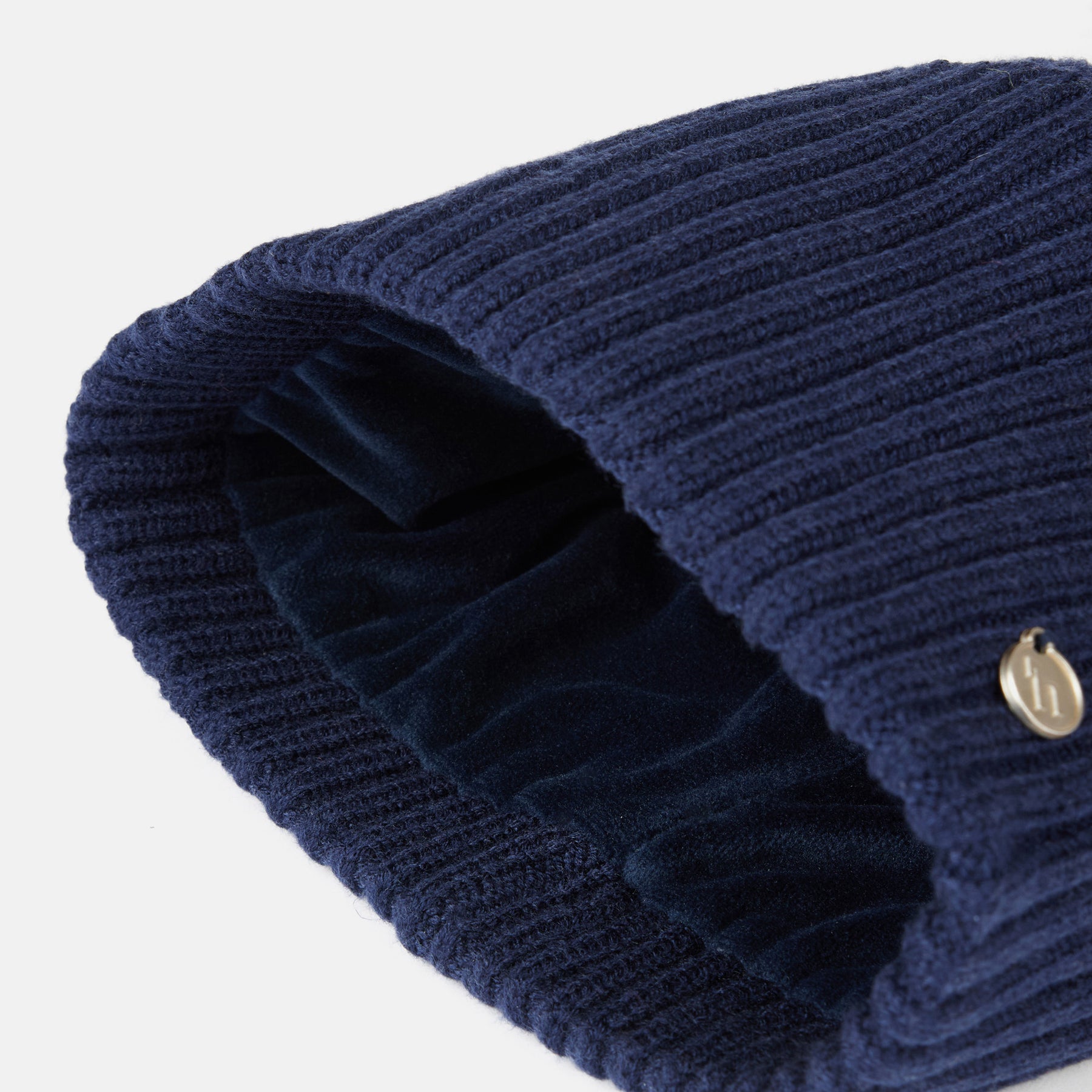 Interior view of the Seaborne Navy Horze Anni Kids Knitted Hat on a plain background