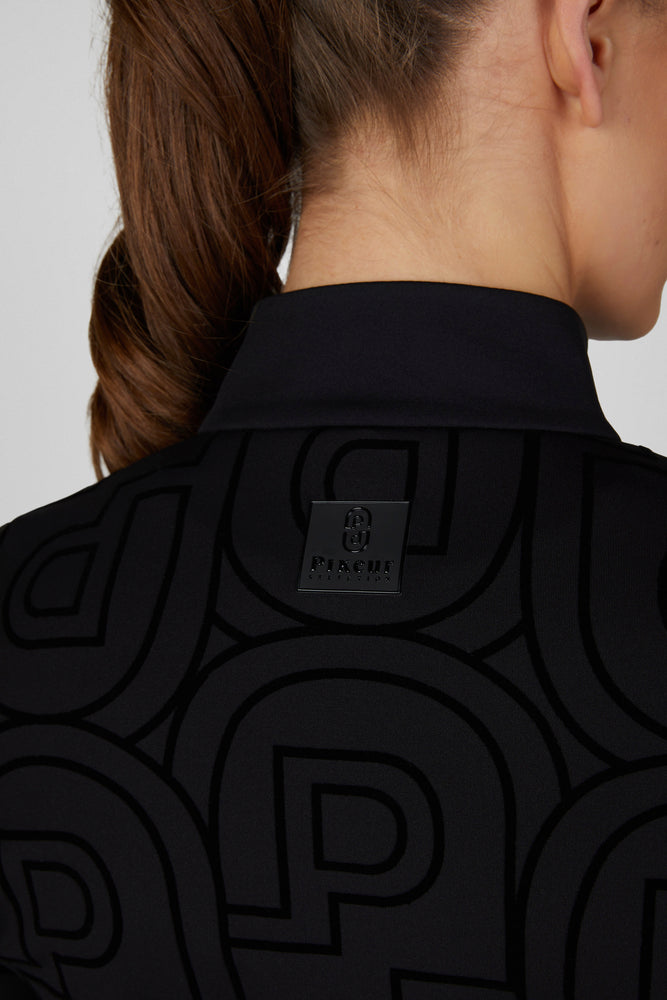 Close-up back view of a female model wearing the Black Pikeur Zip Print Shirt on a plain background