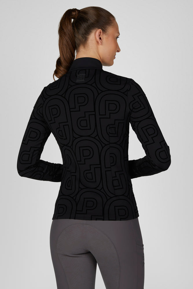 Back view of a female model wearing the Black Pikeur Zip Print Shirt on a plain background