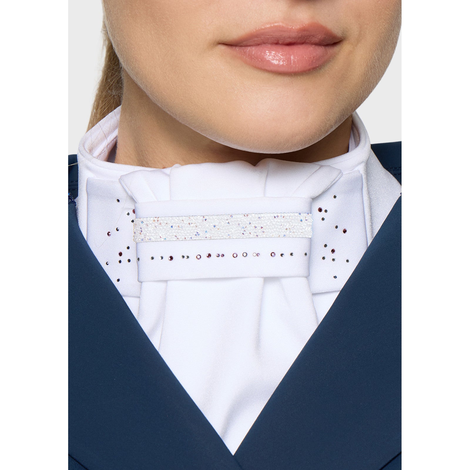 Close-up front view of a model wearing the Holo Fall 2026 Samshield Plastron Premium Stock Tie under a blue show coat