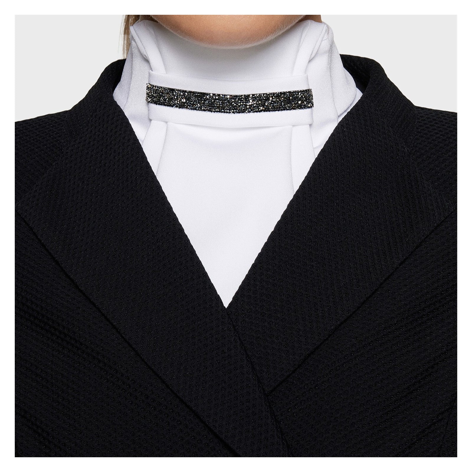 Front view of a model wearing the Black Samshield Plastron Premium Stock Tie under a black show coat