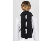 Back view of a female model wearing an inflated Freejump Plume Airvest on a plain background