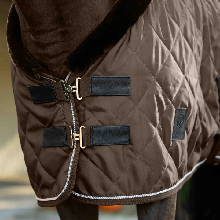 Brown fabric quilted stable blanket with faux fur neck lining shown on horse