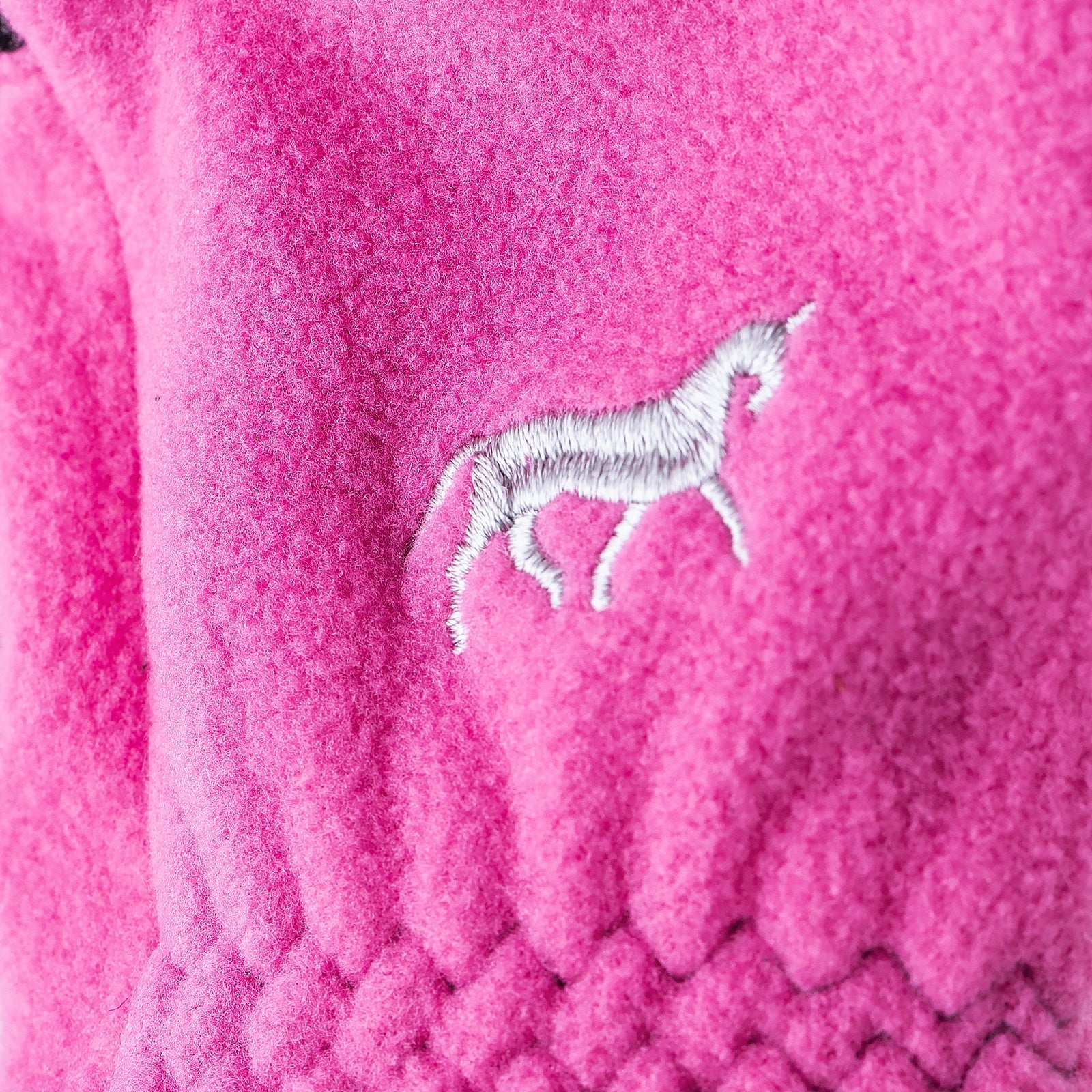Close-up view of the logo on the Deep Coral Pink Horze Kids Fleece Gloves