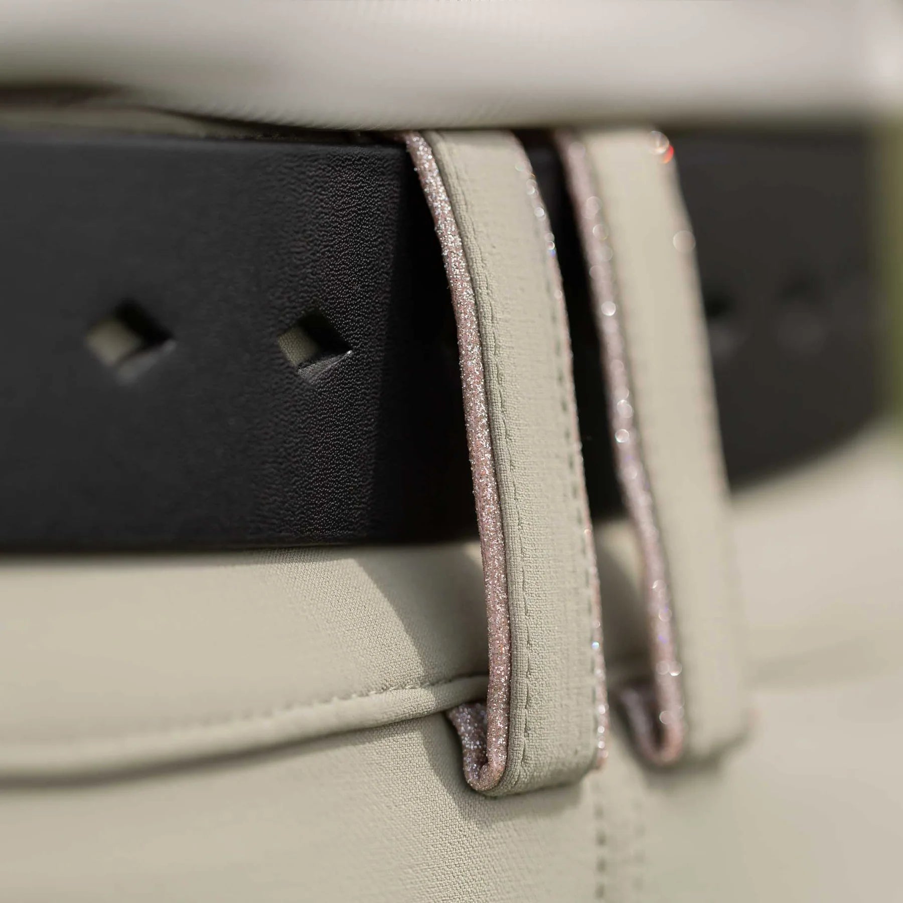 Angled back closeup view of a model wearing the the Equinavia Milli Diamonds Leather Belt showing the diamond-shaped notches