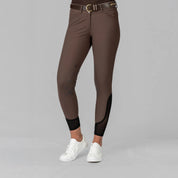 Front view of a model wearing the Dark Brown Equinavia Maud Tech Knee Patch Breeches on a plain background