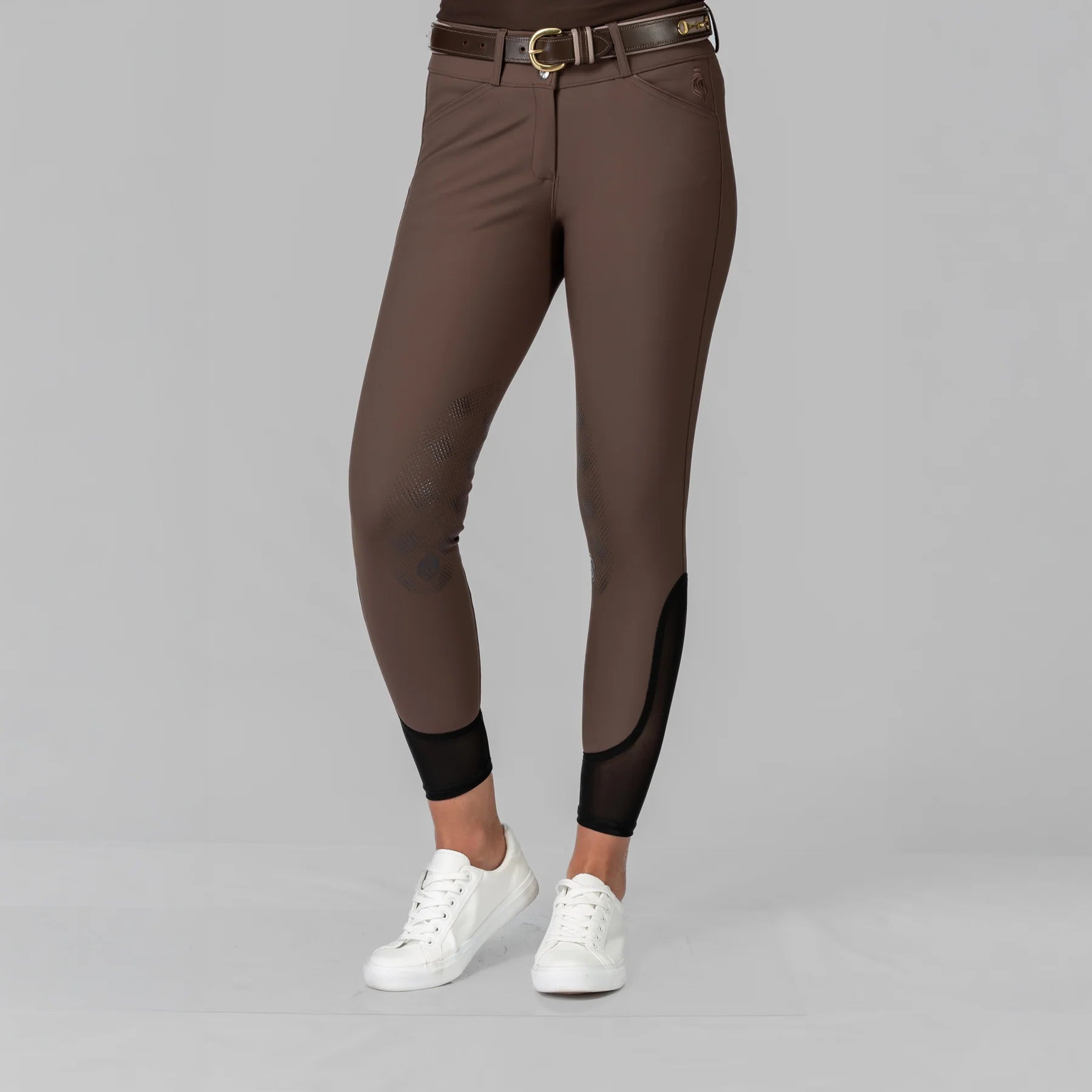 Front view of a model wearing the Dark Brown Equinavia Maud Tech Knee Patch Breeches on a plain background