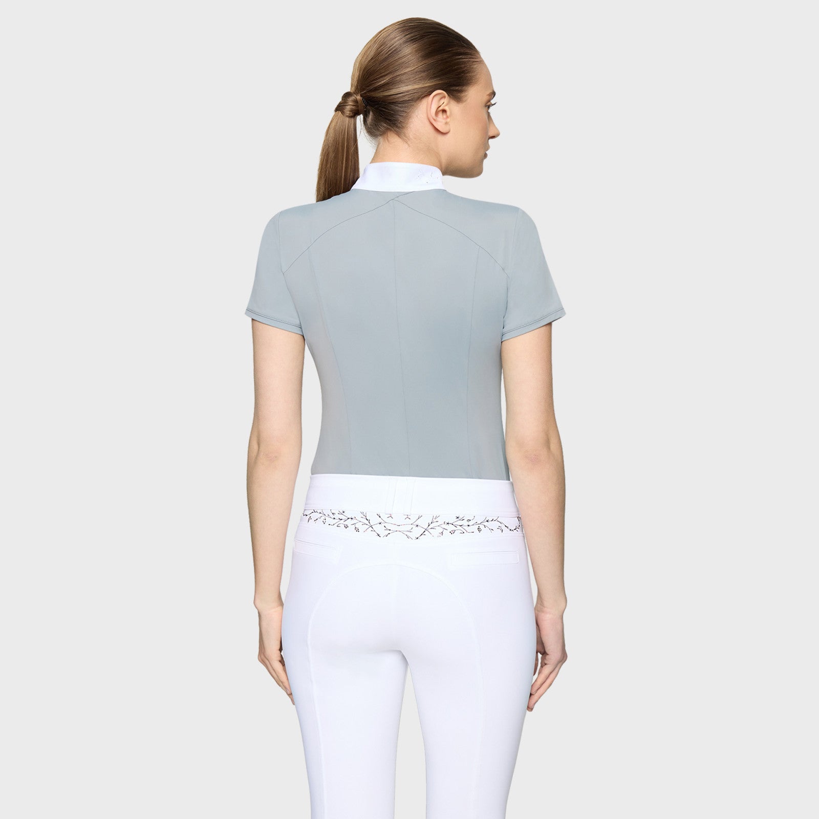 Back view of a female model wearing the Grey Samshield Rosaline Premium Short Sleeve Show Shirt on a plain background